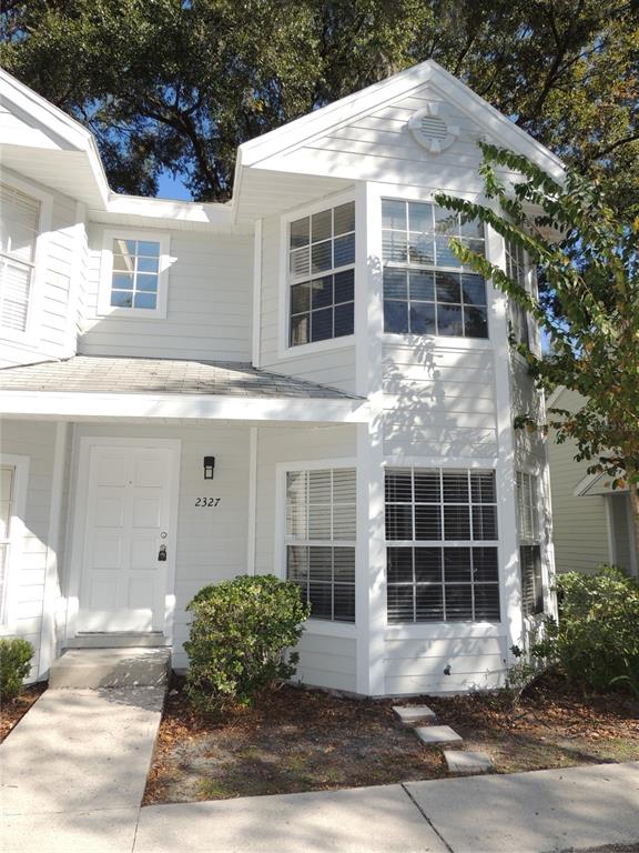 2327 Southwest 73rd Terrace Gainesville, FL 32607 - Photo 1 of 1 a front view of a house with a yard and garage