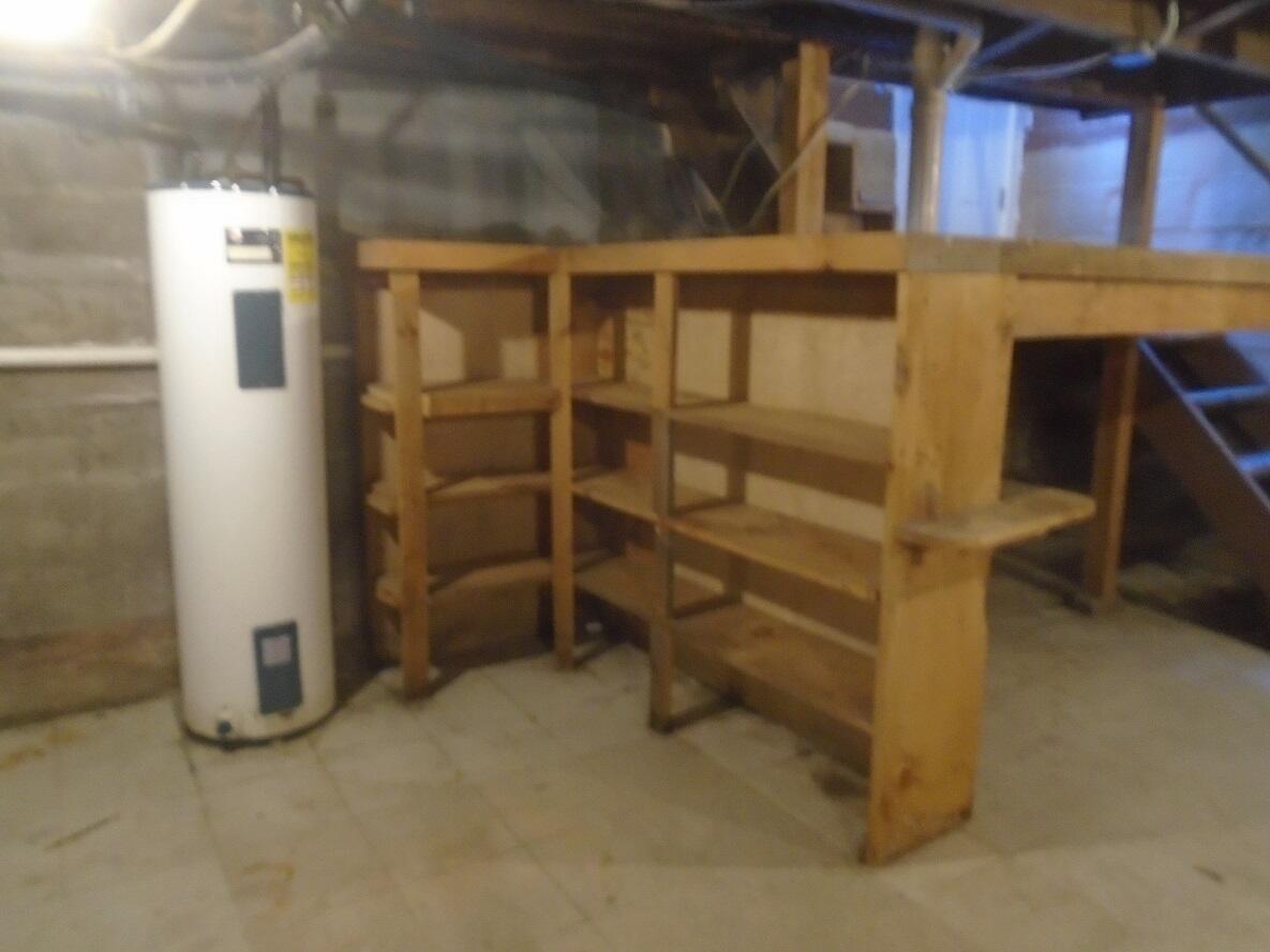 23 Fowler Street Augusta, ME 04330 - Photo 24 of 25 24 Basement shelving
