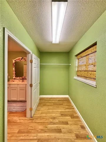 a view of a livingroom with wooden floor