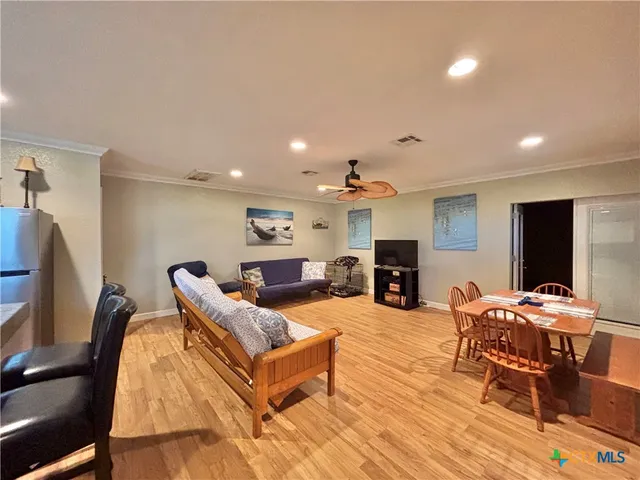 a living room with fireplace furniture and a flat screen tv