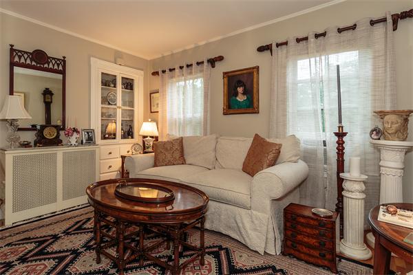 151 Appleton Street Cambridge, MA 02138 - Photo 2 of 15 a living room with furniture a flat screen tv and a window