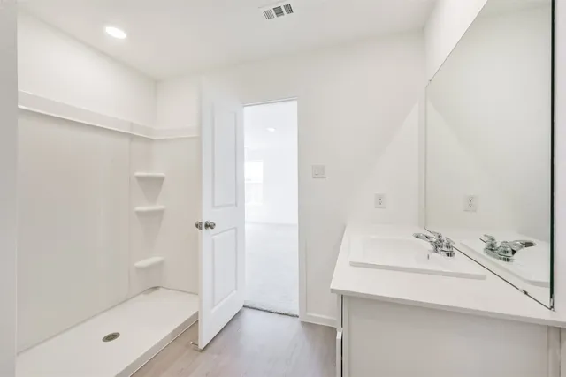a bathroom with a bathtub and a toilet