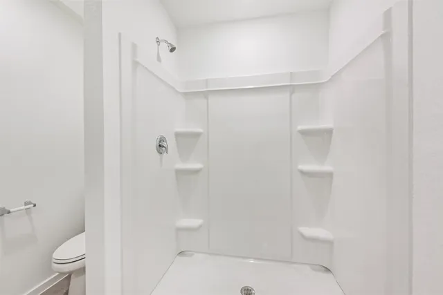 a view of an empty walk in closet