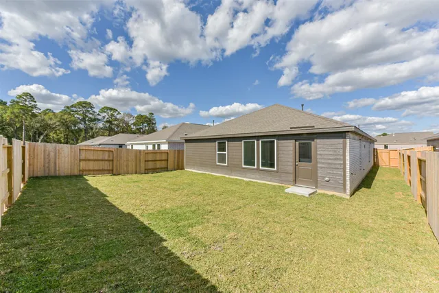 a view of back yard of the house