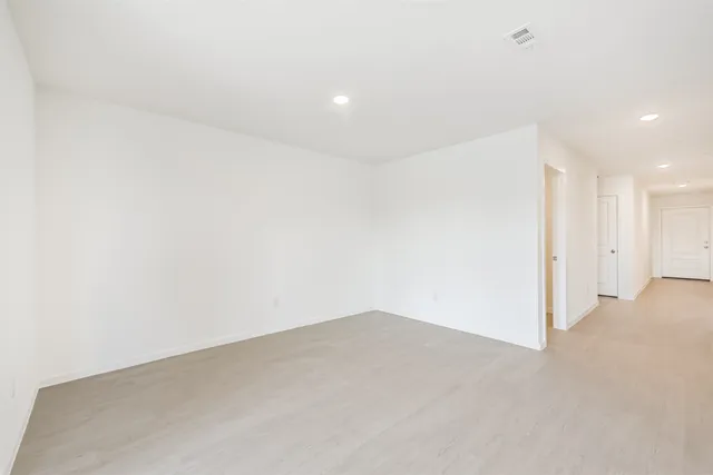 a view of a kitchen with a sink and a window