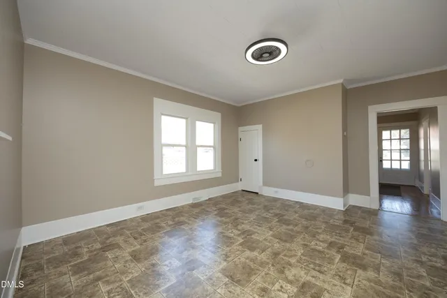 a view of livingroom with an empty space and window