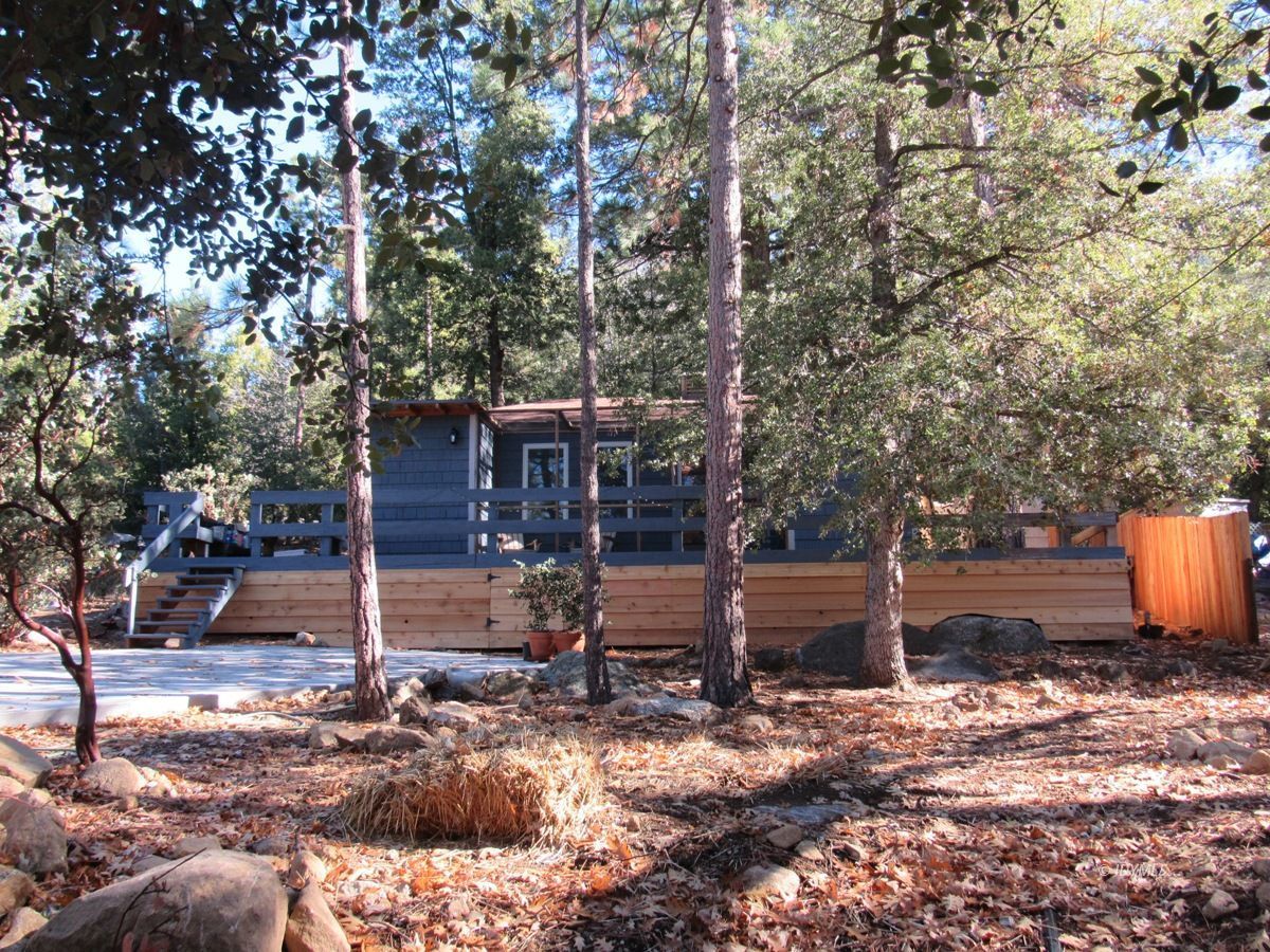 25650 Seneca Road Idyllwild, CA 92549 - Photo 1 of 23 a view of a backyard with large trees