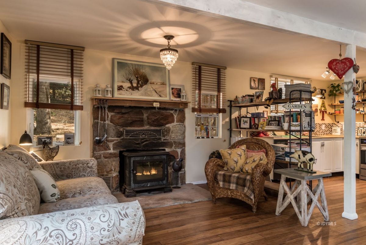 25650 Seneca Road Idyllwild, CA 92549 - Photo 4 of 23 a living room with furniture and a fireplace