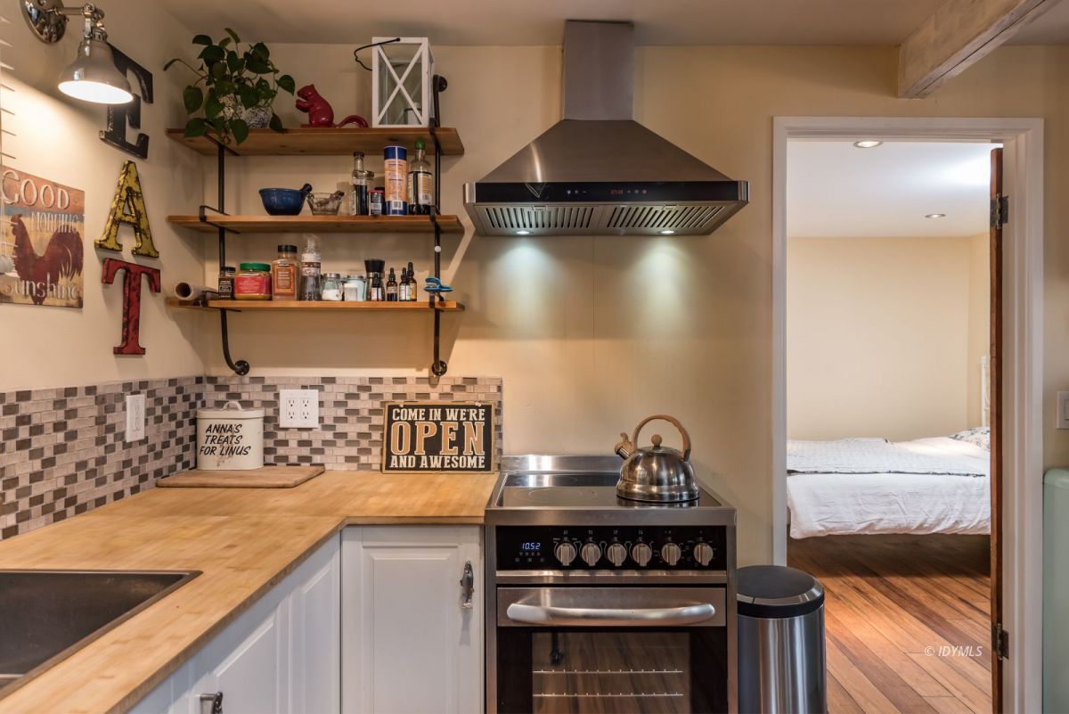 25650 Seneca Road Idyllwild, CA 92549 - Photo 8 of 23 a kitchen with a stove and cabinets