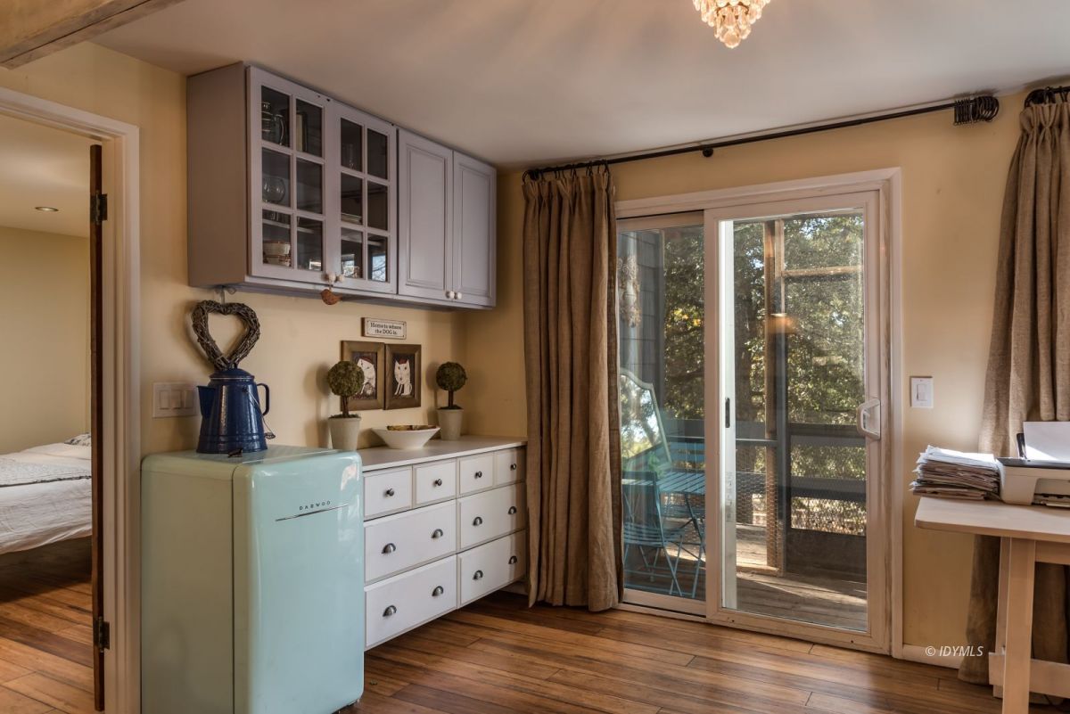 25650 Seneca Road Idyllwild, CA 92549 - Photo 9 of 23 a kitchen with cabinets and wooden floor