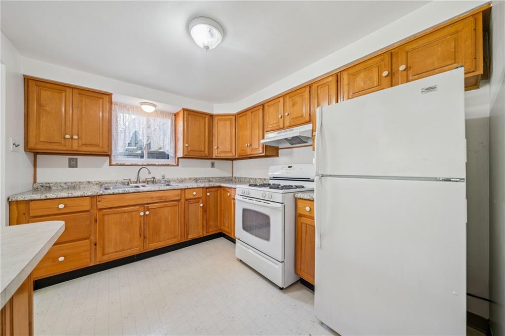1135 Harvard Road Monroeville, PA 15146 - Photo 10 of 35 Well-appointed kitchen offering ample cabinet storage and generous counter space, perfect for cooking and entertaining.