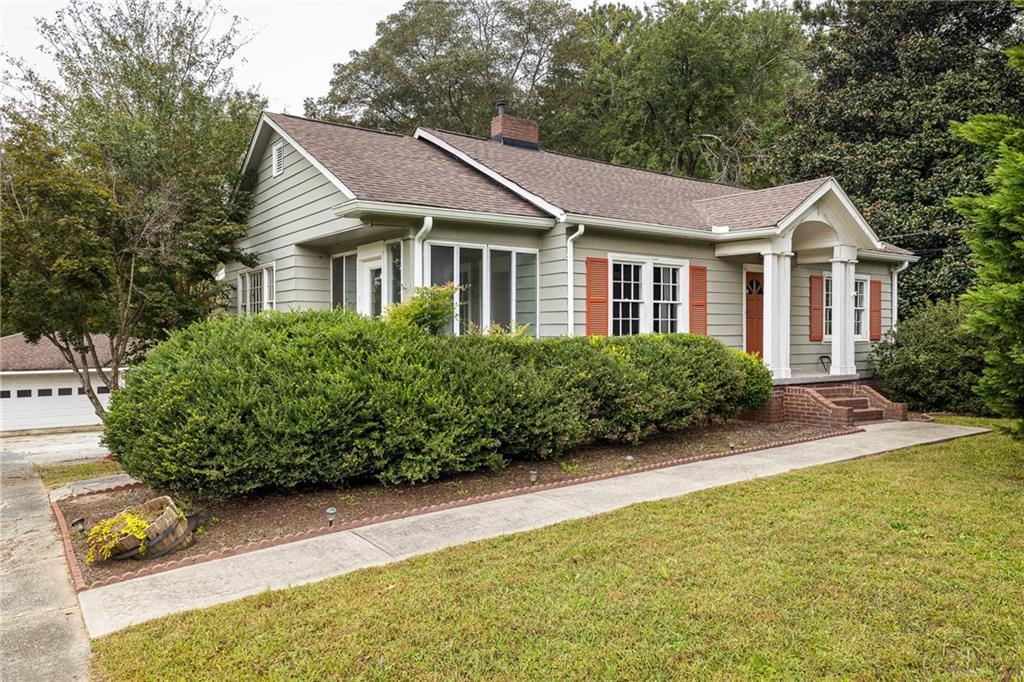 4520 Austell Powder Springs Road Southwest Powder Springs, GA 30127 - Photo 1 of 1 a view of a house with garden