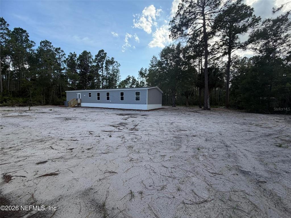 114 Nutmeg Trail Interlachen, FL 32148 - Photo 30 of 33 a view of a dry yard with trees