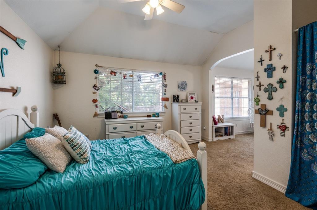 707 Bent Tree Court Coppell, TX 75019 - Photo 15 of 39 a bedroom with a bed couch and window