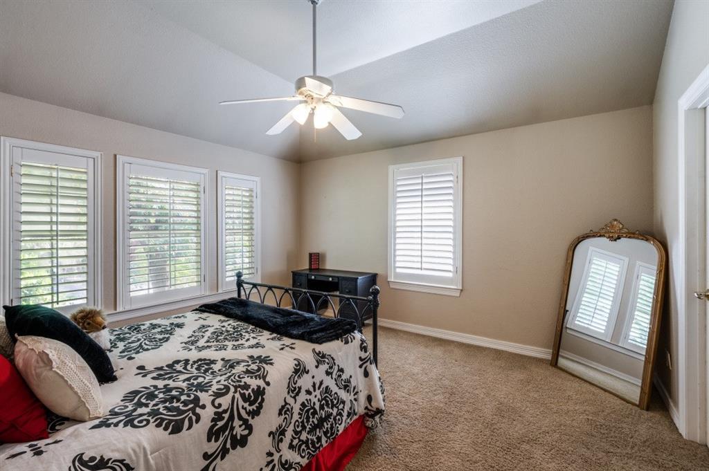 707 Bent Tree Court Coppell, TX 75019 - Photo 21 of 39 a bedroom with a bed and a window