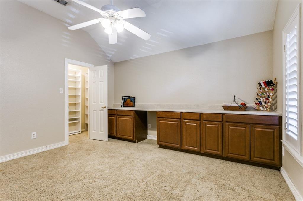 707 Bent Tree Court Coppell, TX 75019 - Photo 22 of 39 a kitchen with cabinets a sink and appliances