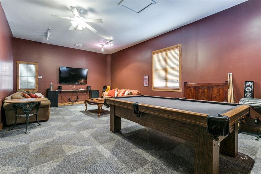 707 Bent Tree Court Coppell, TX 75019 - Photo 24 of 39 a living room with furniture and a flat screen tv