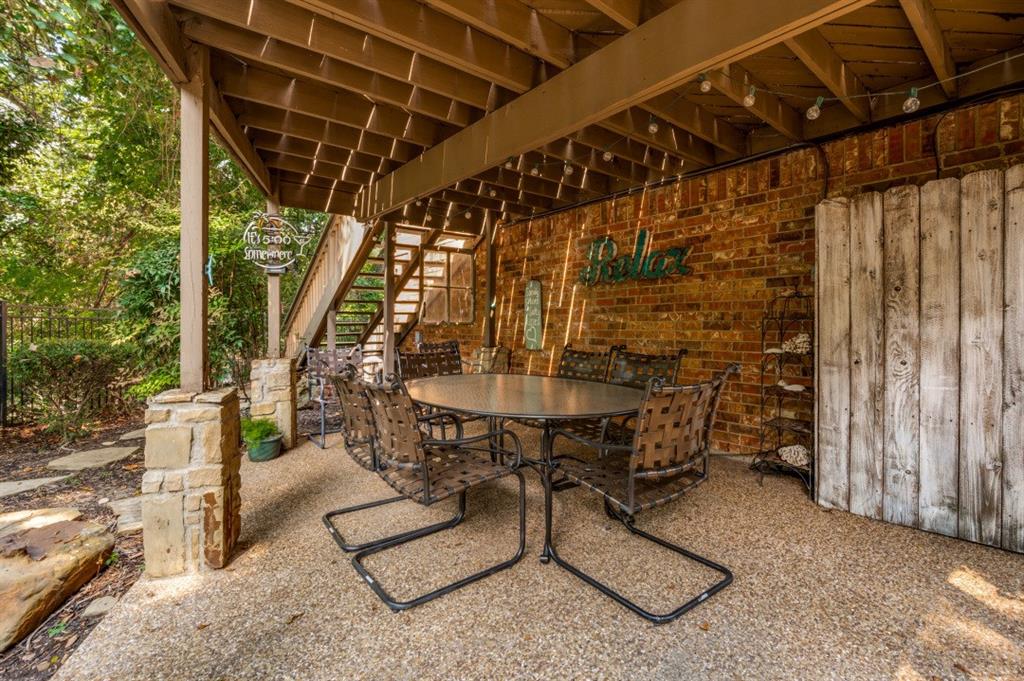 707 Bent Tree Court Coppell, TX 75019 - Photo 27 of 39 a view of sitting area with porch and a table