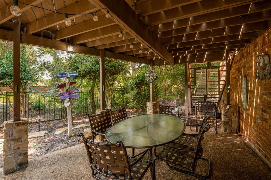 707 Bent Tree Court Coppell, TX 75019 - Photo 28 of 39 a view of a chairs and table in the patio