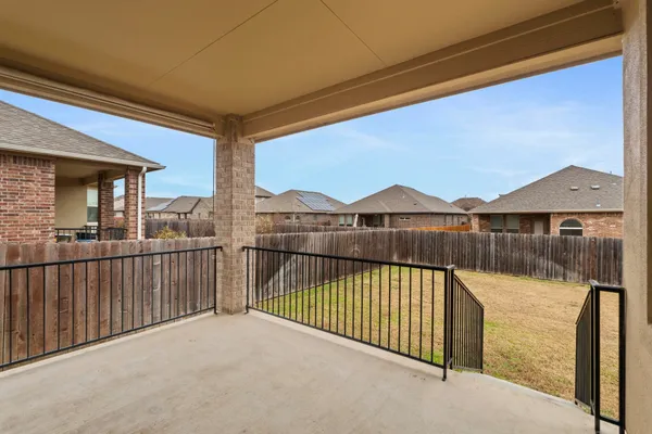 a view of swimming pool and deck in the backyard of house