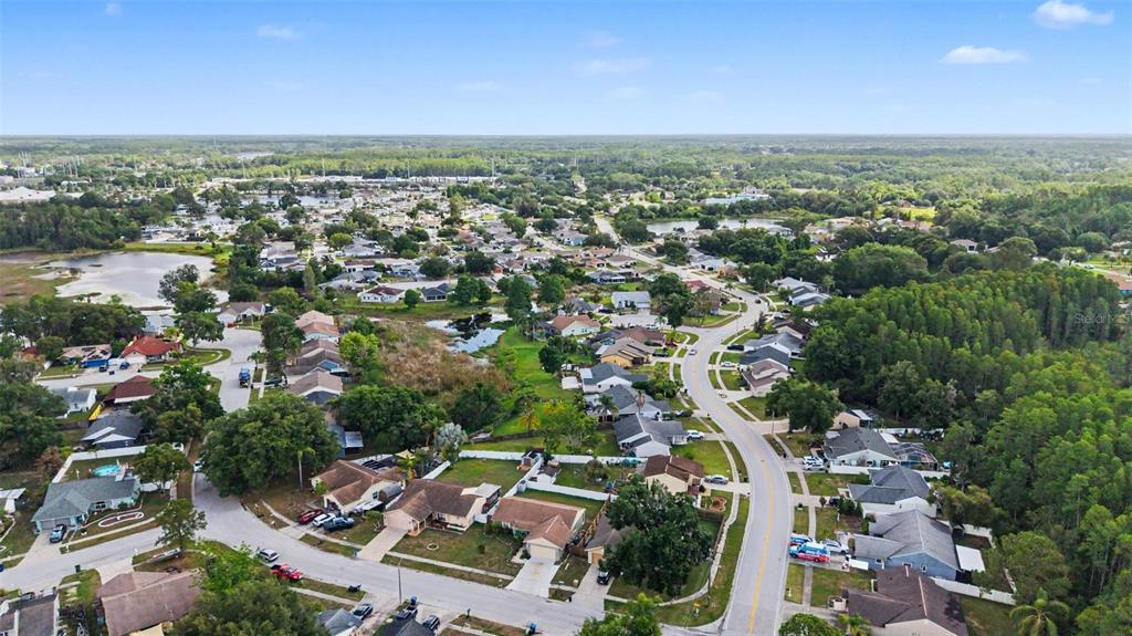 1632 Pintail Court Lutz, FL 33549 - Photo 32 of 34 an aerial view of a city with lots of residential buildings