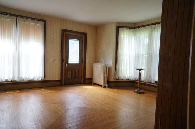 3-s015 Dauberman Road Elburn, IL 60119 - Photo 5 of 15 an empty room with wooden floor and windows