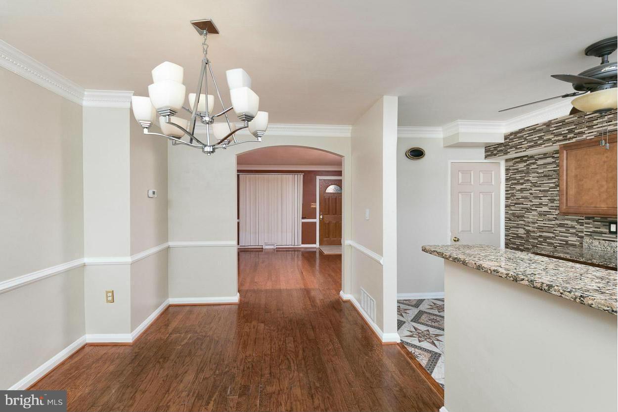 573 Brisbane Road Baltimore, MD 21229 - Photo 1 of 30 a view of a livingroom with wooden floor