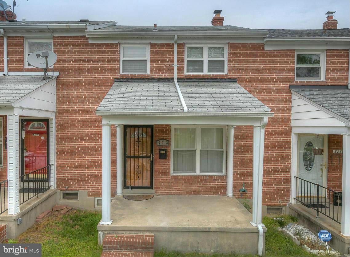 573 Brisbane Road Baltimore, MD 21229 - Photo 13 of 30 a front view of a house with glass windows and door
