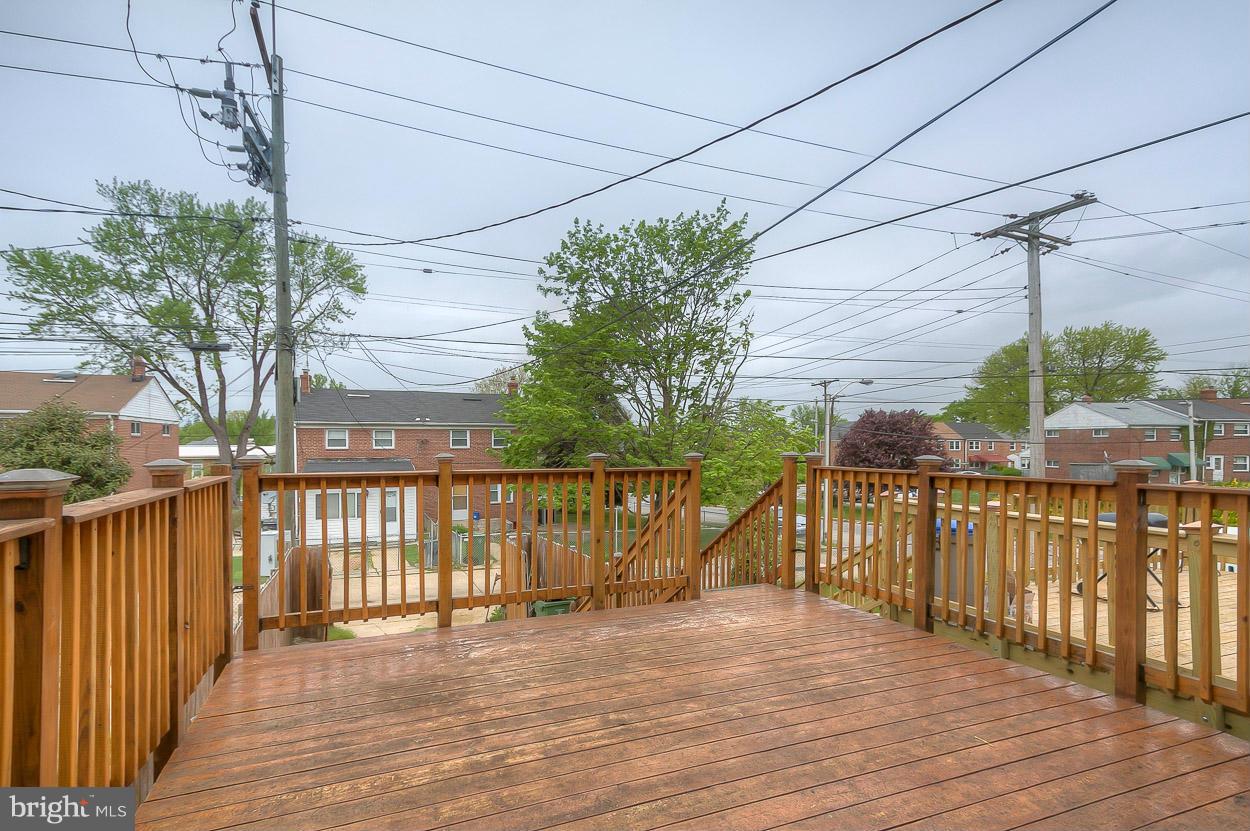 573 Brisbane Road Baltimore, MD 21229 - Photo 17 of 30 a view of a balcony with wooden floor and fence