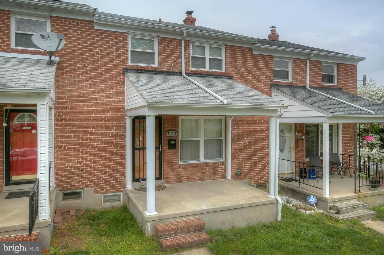 573 Brisbane Road Baltimore, MD 21229 - Photo 29 of 30 a front view of a house with a yard