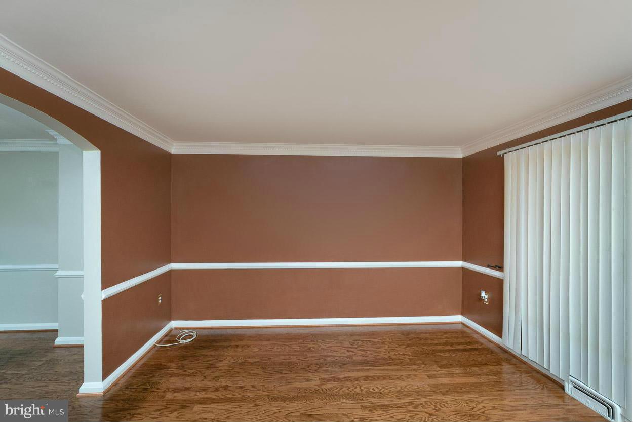 573 Brisbane Road Baltimore, MD 21229 - Photo 10 of 30 a view of an empty room with wooden floor