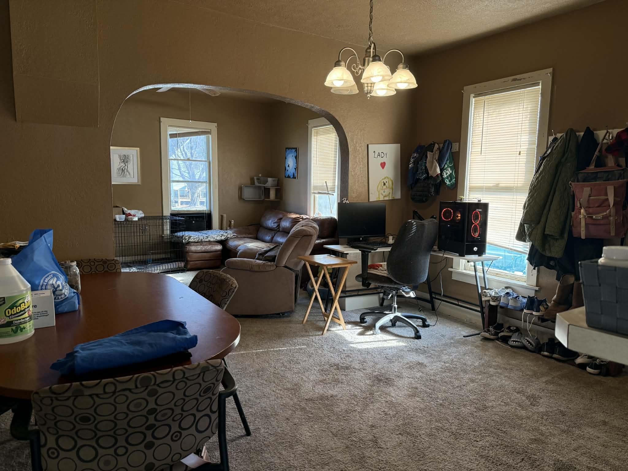 505 East Main Street Durand, IL 61024 - Photo 5 of 18 a living room with furniture a chandelier and a mirror