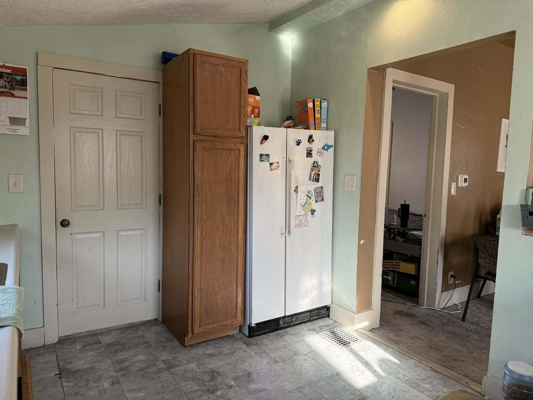 505 East Main Street Durand, IL 61024 - Photo 7 of 18 a view of a kitchen with refrigerator and cabinet