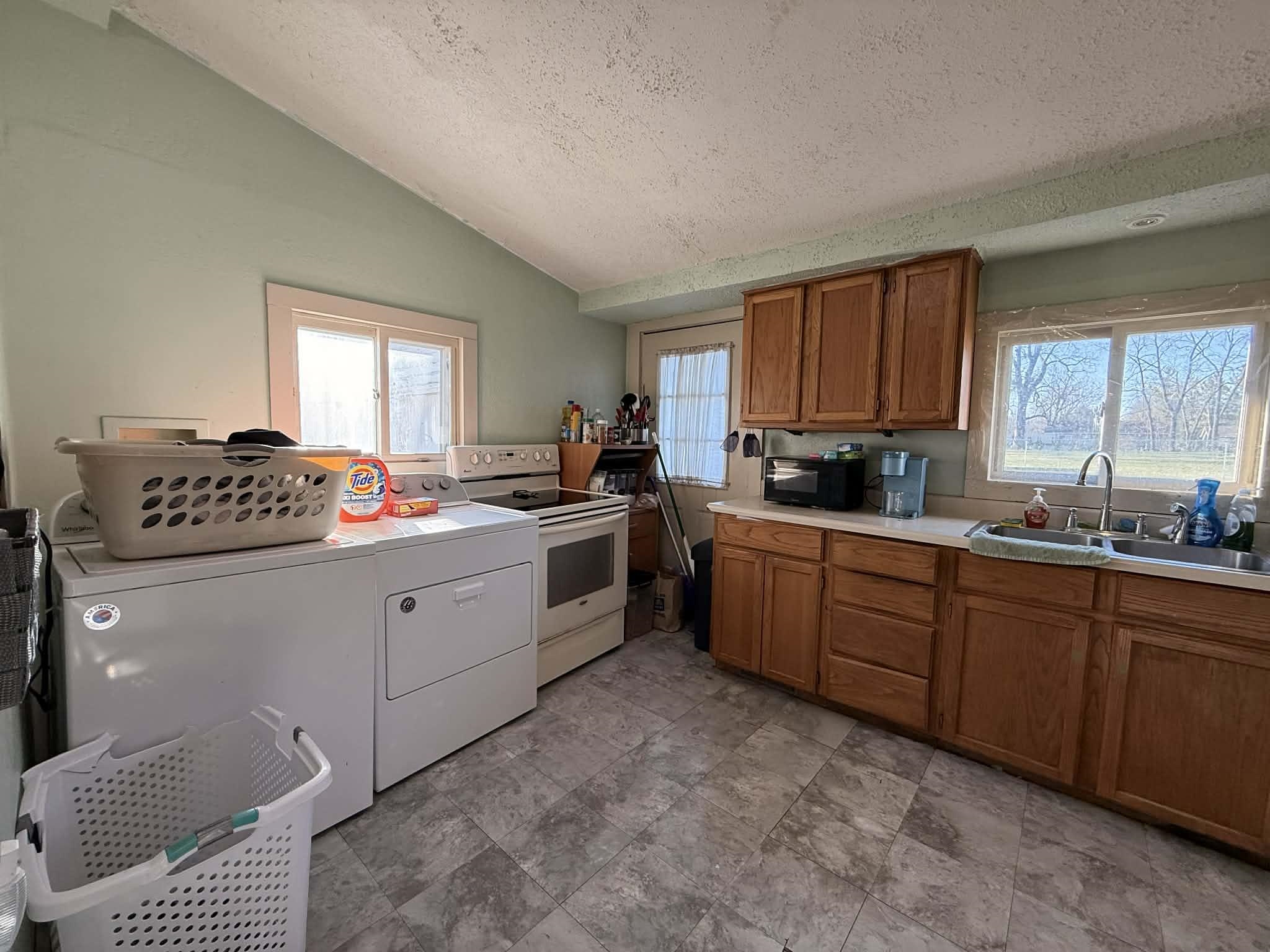 505 East Main Street Durand, IL 61024 - Photo 9 of 18 a kitchen with a sink window and cabinets