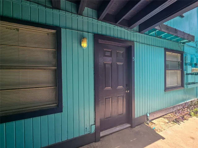 a view of a door and a window