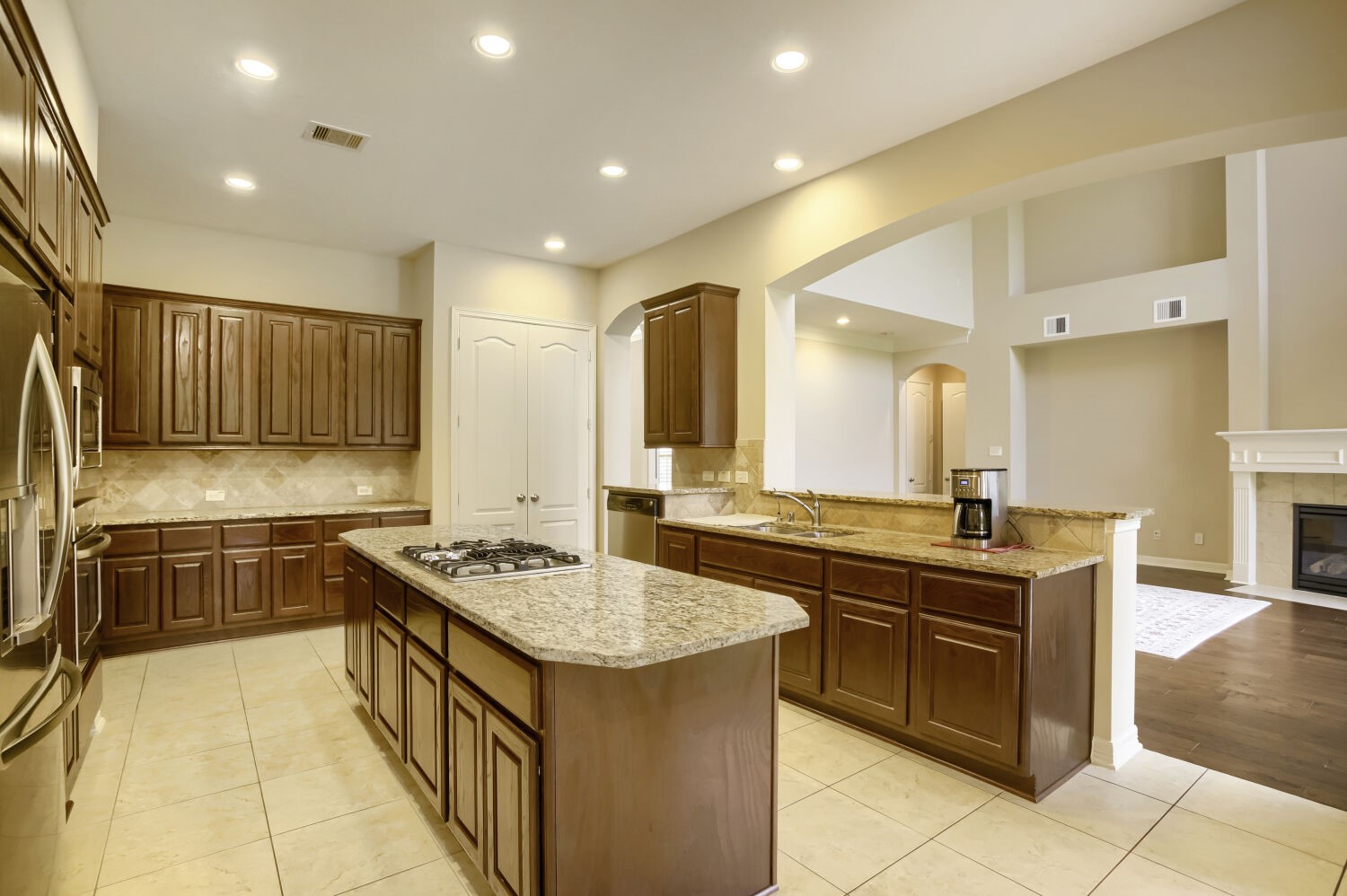 11 Spotted Lily Way The Woodlands, TX 77354 - Photo 13 of 30 a kitchen with stainless steel appliances granite countertop a sink and cabinets