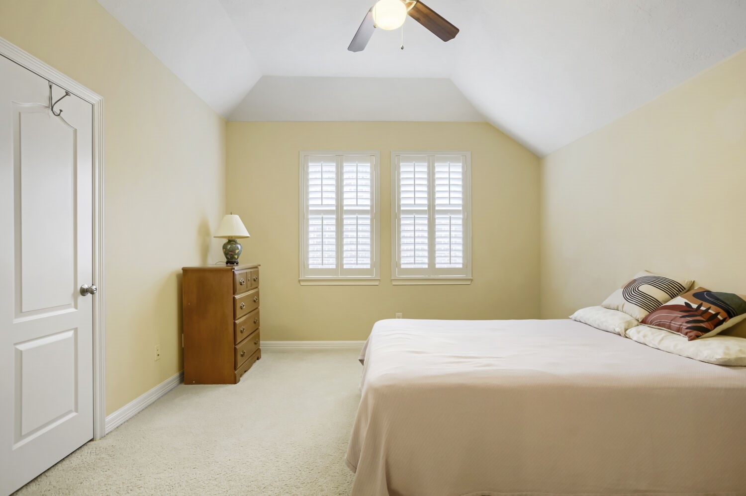 11 Spotted Lily Way The Woodlands, TX 77354 - Photo 16 of 30 a bedroom with a bed and a chandelier
