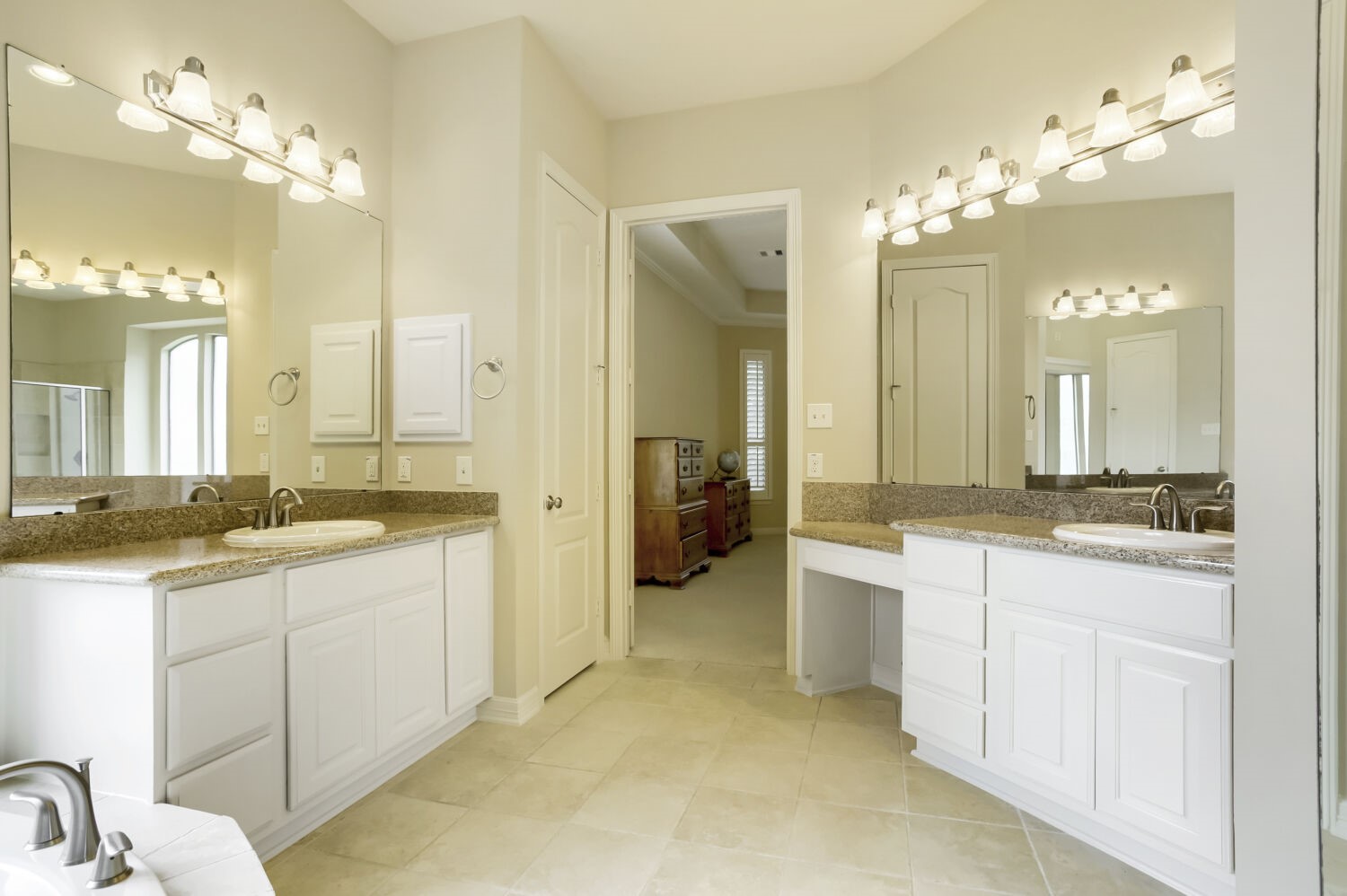 11 Spotted Lily Way The Woodlands, TX 77354 - Photo 22 of 30 a spacious bathroom with a granite countertop sink a large mirror and a shower