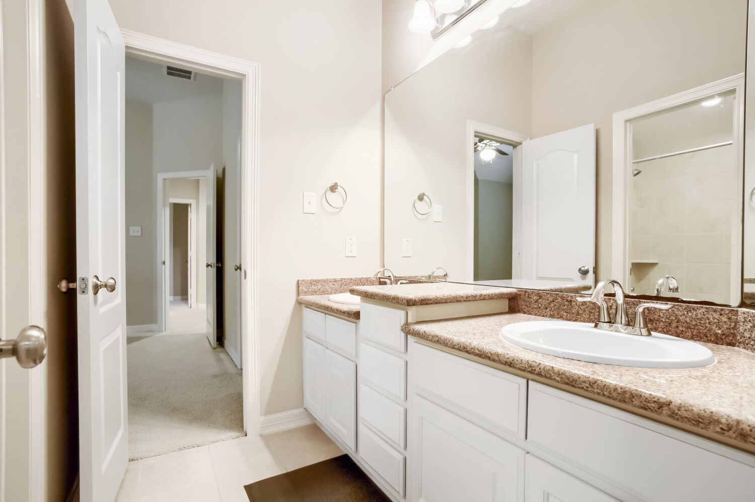 11 Spotted Lily Way The Woodlands, TX 77354 - Photo 23 of 30 a bathroom with a granite countertop sink and a mirror
