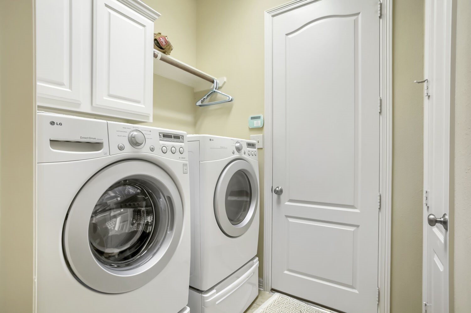11 Spotted Lily Way The Woodlands, TX 77354 - Photo 26 of 30 a utility room with dryer and washer