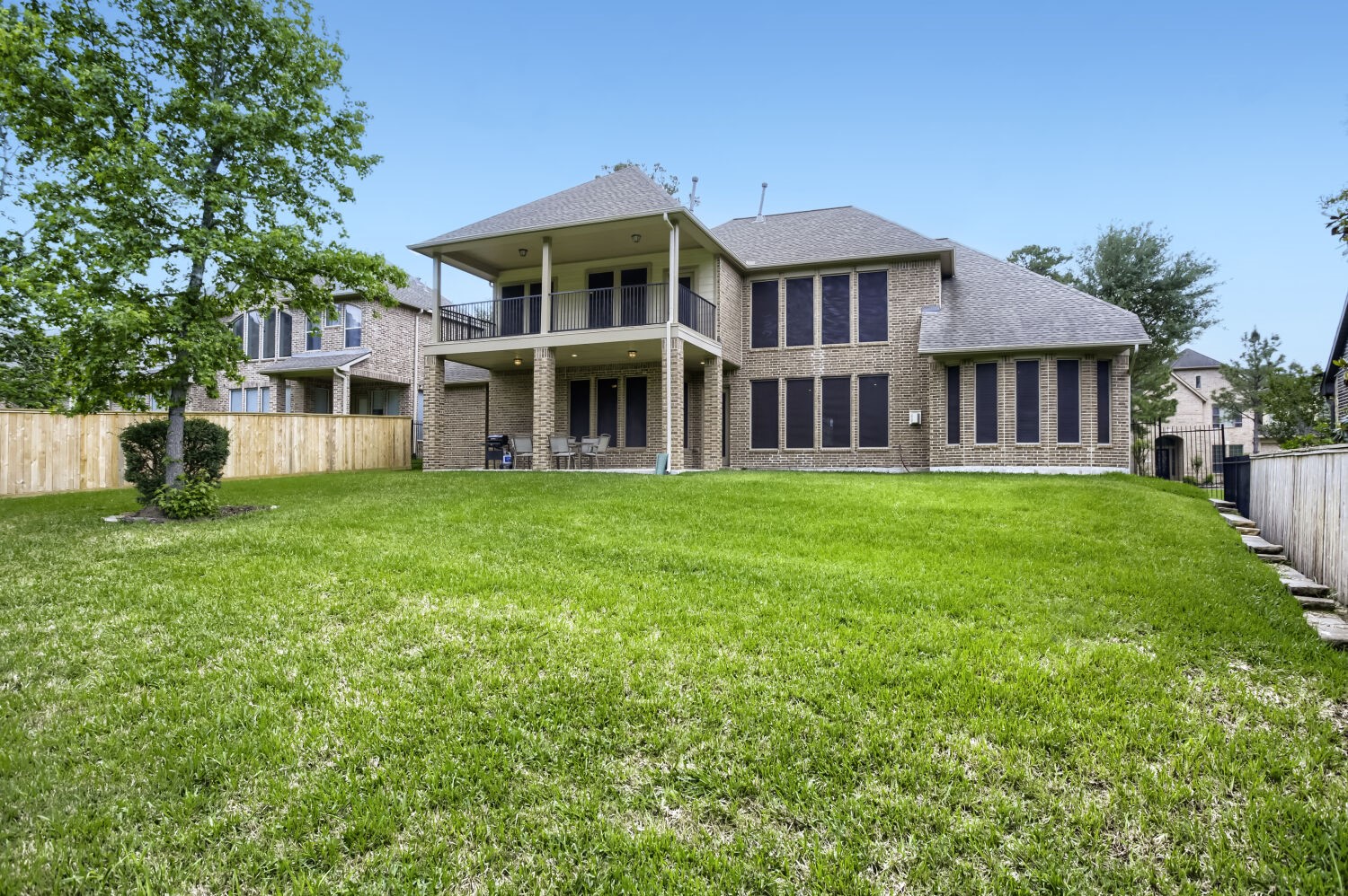 11 Spotted Lily Way The Woodlands, TX 77354 - Photo 27 of 30 a front view of a house with a yard