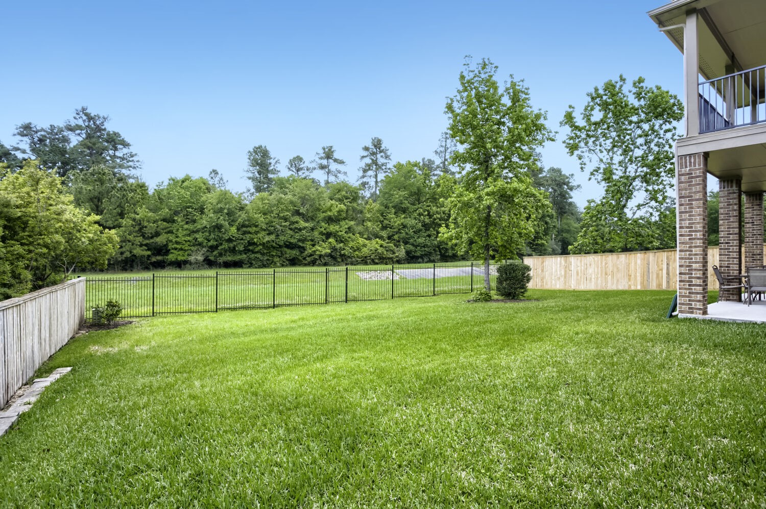 11 Spotted Lily Way The Woodlands, TX 77354 - Photo 28 of 30 a view of a backyard with a small park