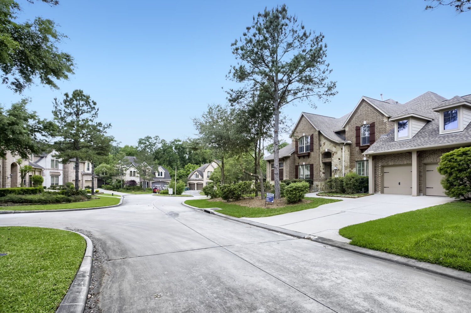11 Spotted Lily Way The Woodlands, TX 77354 - Photo 3 of 30 a front view of a house with a yard and trees