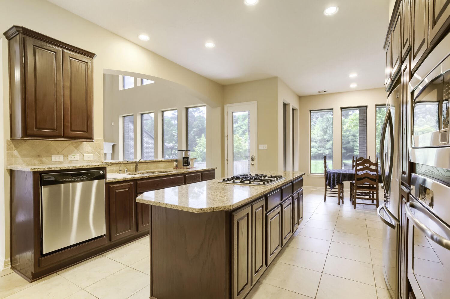 11 Spotted Lily Way The Woodlands, TX 77354 - Photo 6 of 30 a kitchen with counter top space and windows