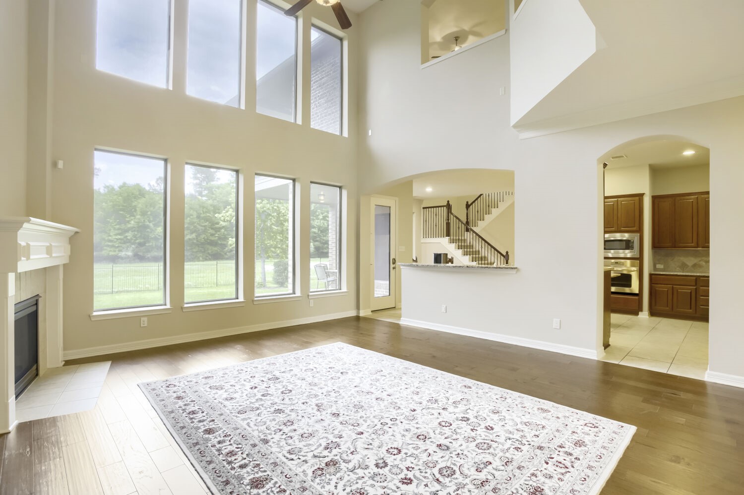 11 Spotted Lily Way The Woodlands, TX 77354 - Photo 9 of 30 a view of a big room with wooden floor and windows