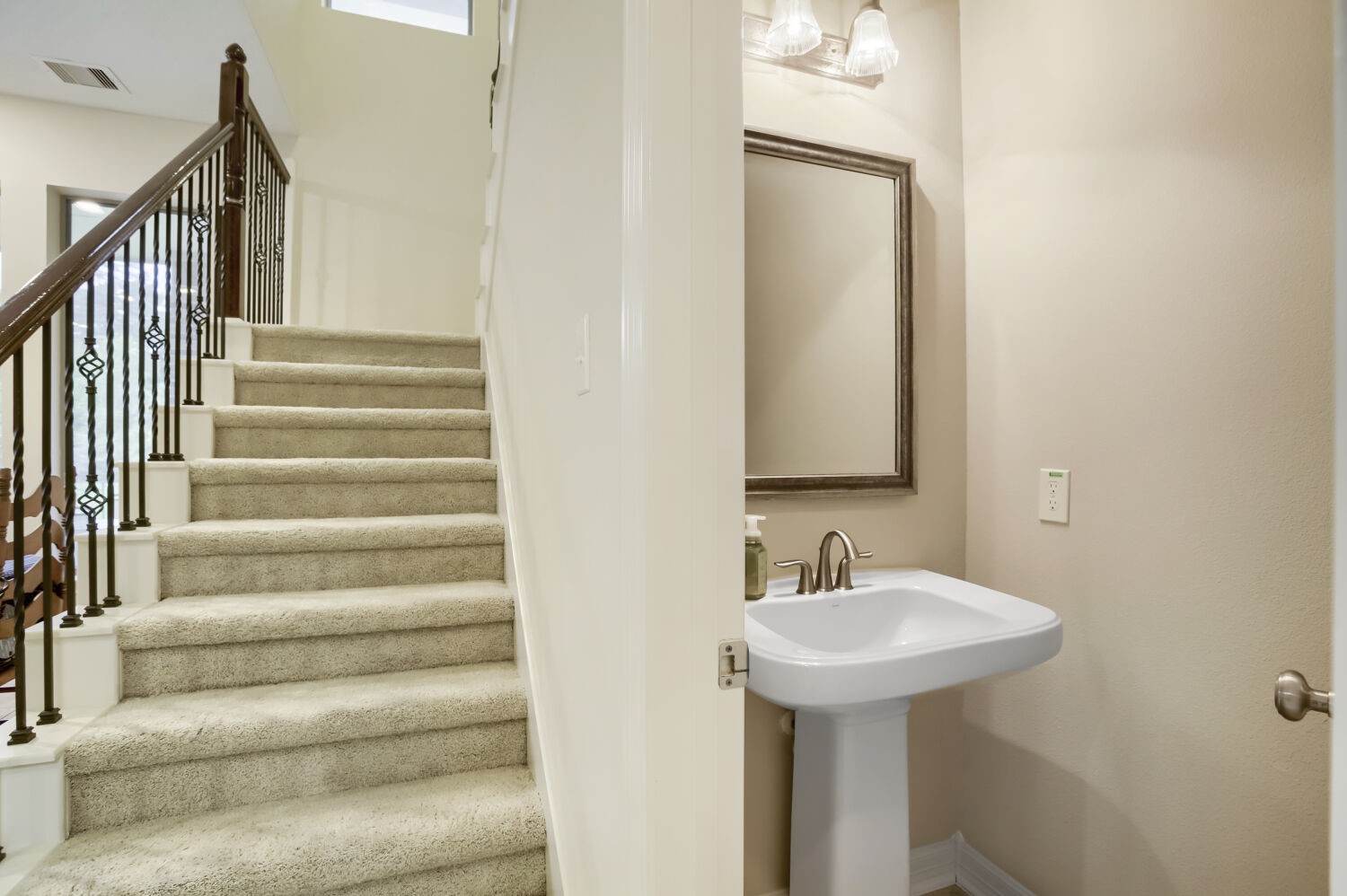 11 Spotted Lily Way The Woodlands, TX 77354 - Photo 10 of 30 a bathroom with a sink and a mirror