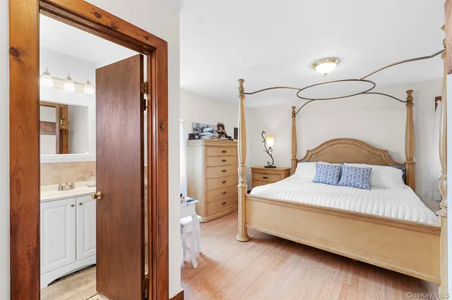 a bathroom with a sink vanity mirror and toilet