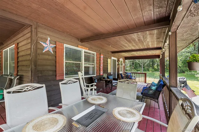 a dining room with furniture and window