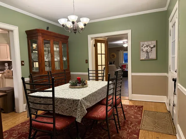 a dining room with furniture and window