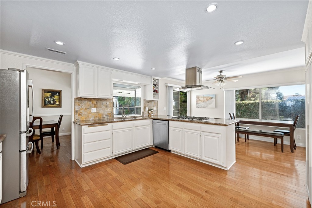 2508 Royale Place Fullerton, CA 92833 - Photo 19 of 53 a kitchen with stainless steel appliances granite countertop a stove and a refrigerator